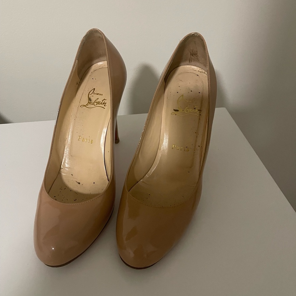 christian louboutin round toe nude pumps